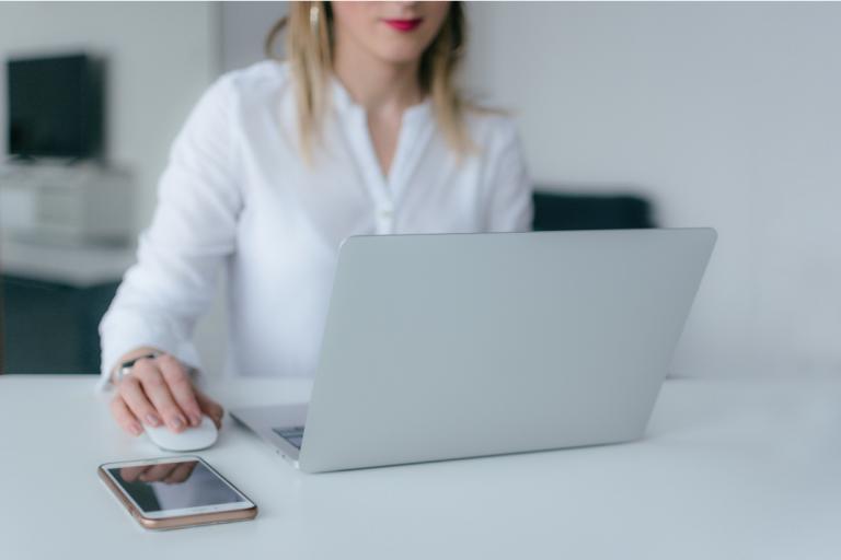 A girl clicking a computer mouse